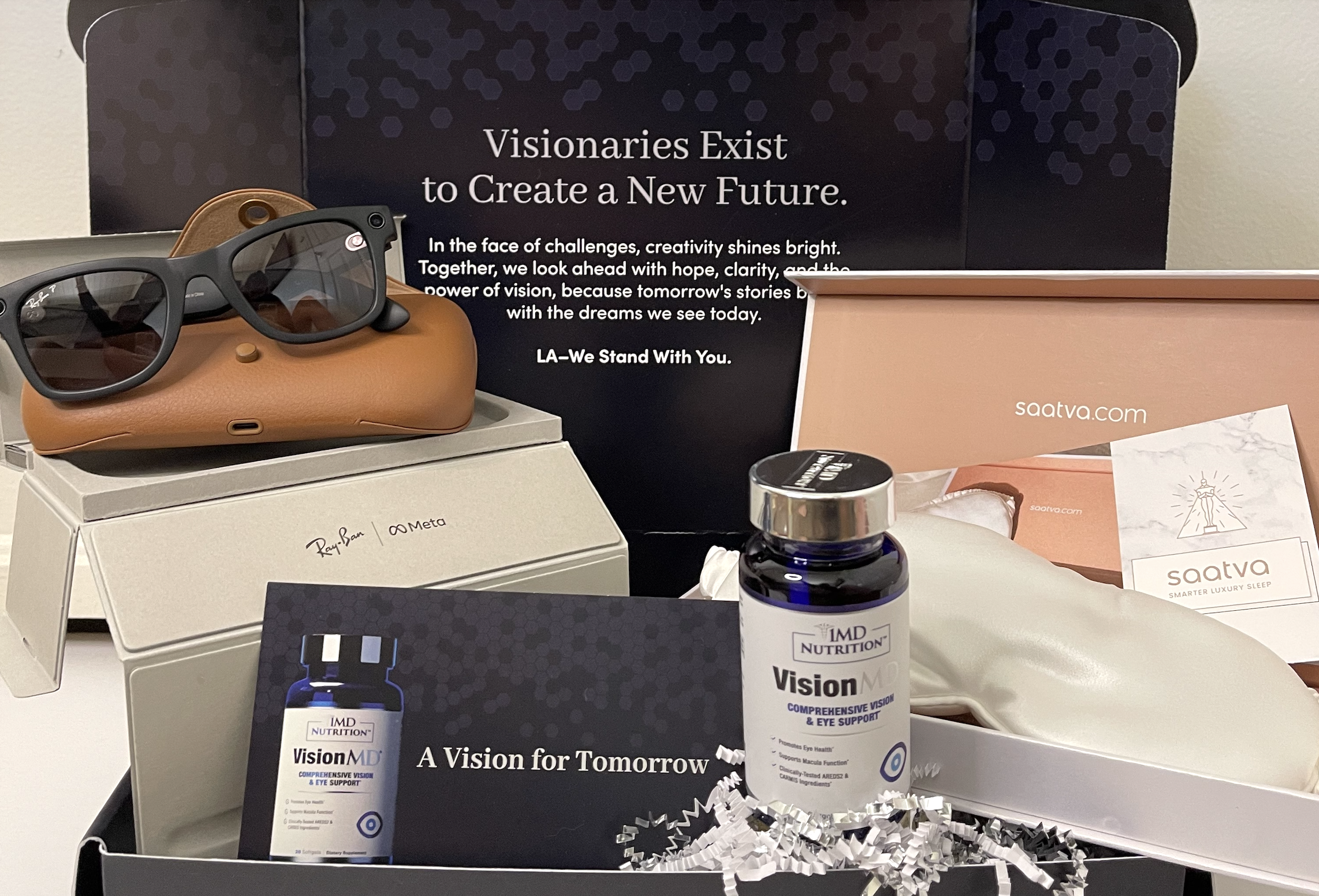 1MD Nutrition’s exclusive “Vision for Tomorrow” Oscar nominee gift box, including 1MD Nutrition's VisionMD supplements, Rayban x Meta sunglasses, and Saatva's award-winning mulberry silk weighted eye mask in white.